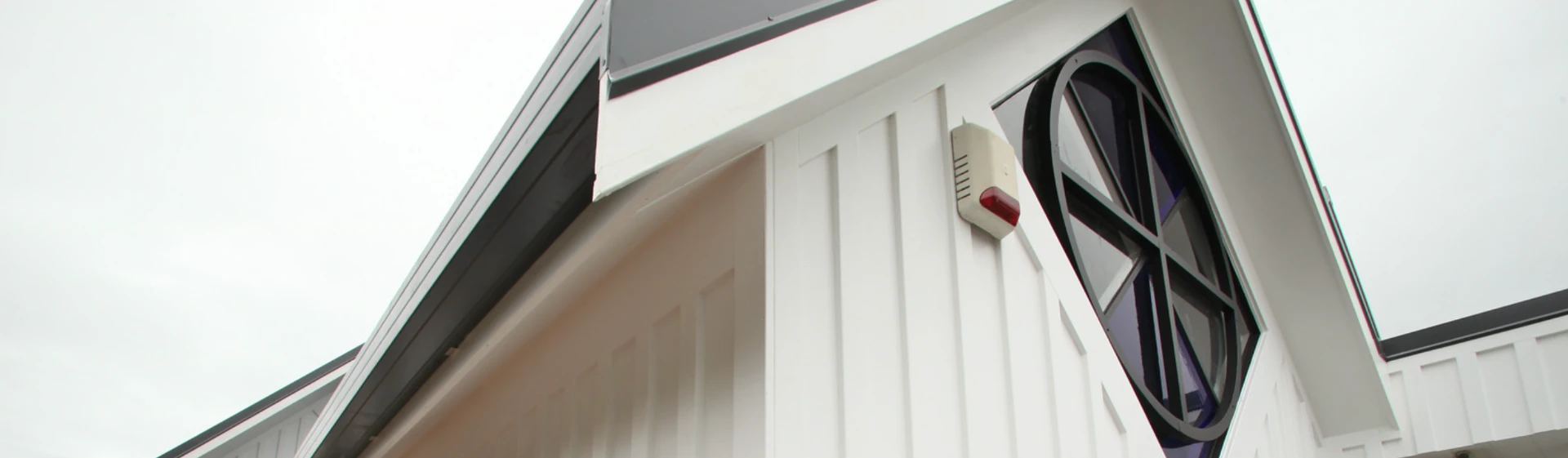 The gabled roofline of 788 Remuera Road seen from below